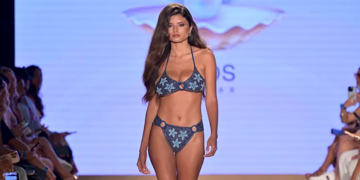 Big boob bikini babe on the fashion runway