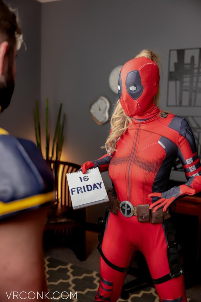 Lady Deadool showing Wolverine a calendar with the date on it