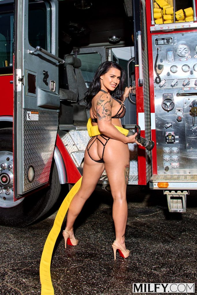 Sexy babe showing off her ass in lingerie at the fire station