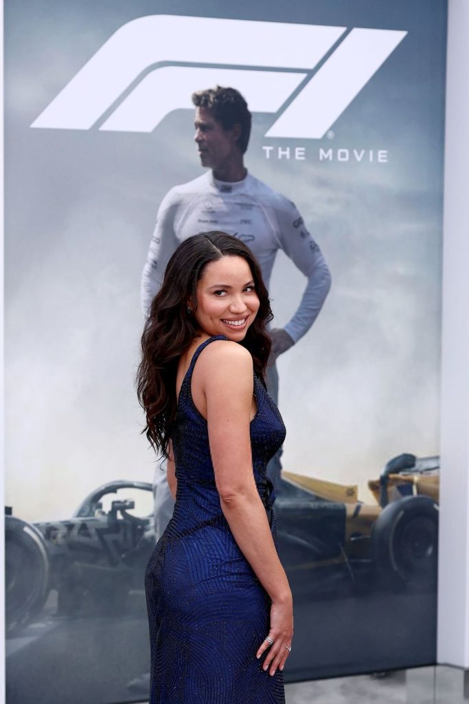 Pretty actress in a tight dress turn to the side on the red carpet