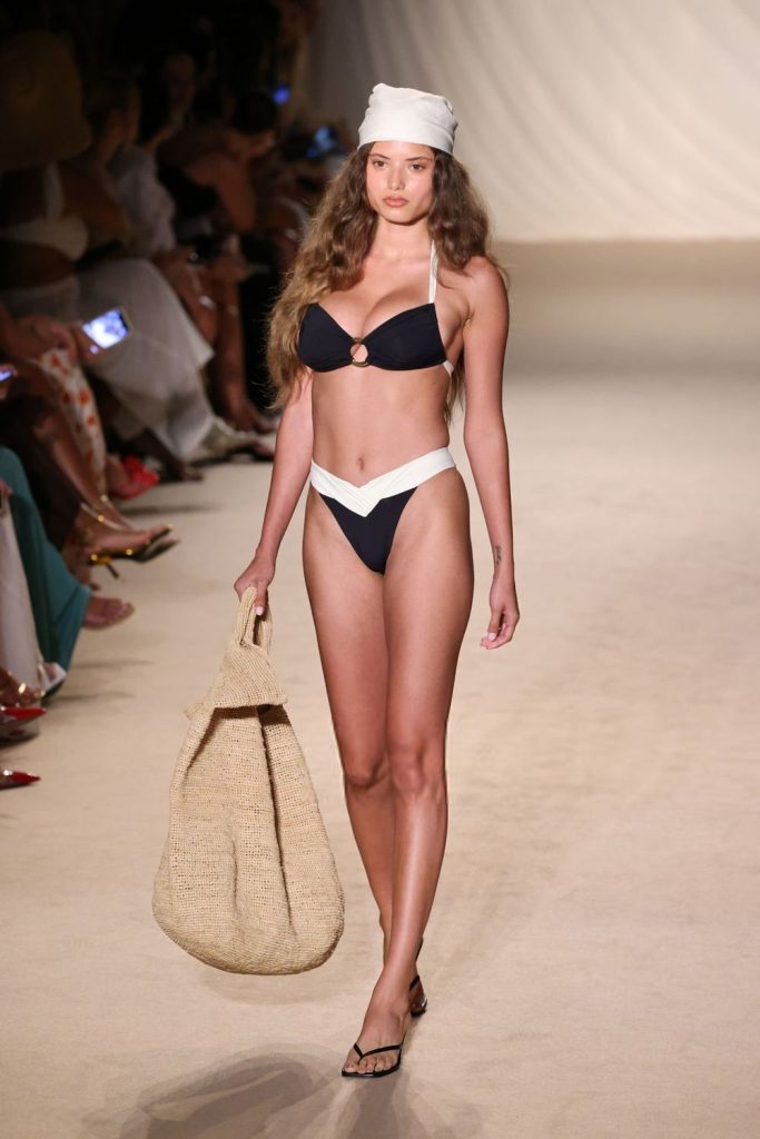 Swimsuit model walks the runway in a bikini