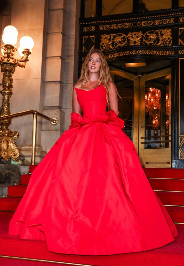 Sydney Sweeney is beautiful in a red dress on a big staircase