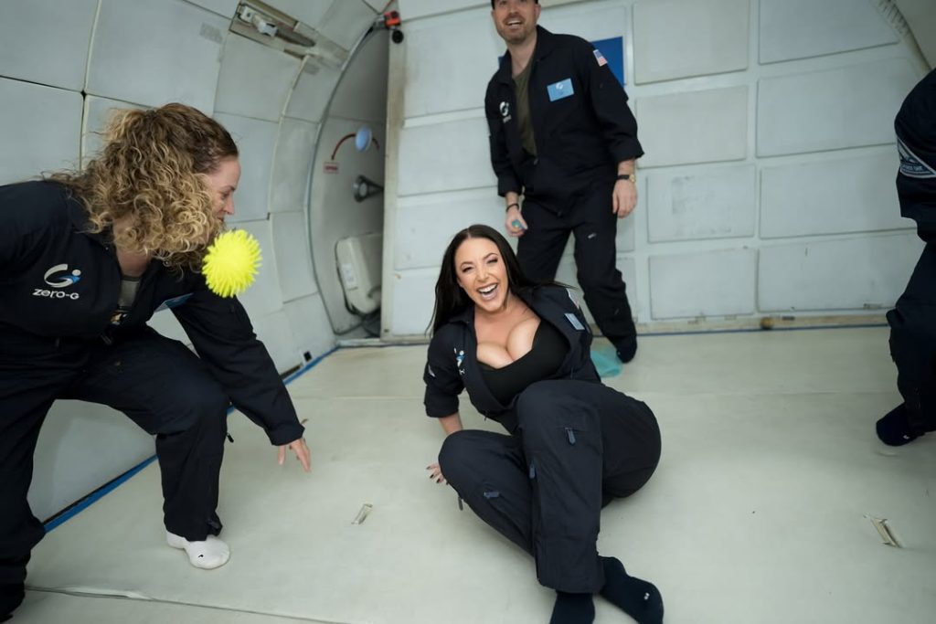Angela White cleavage while getting up after a zero gravity flight