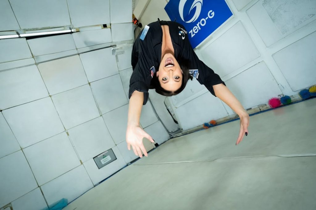 Angela White cleavage while floating upside down in zero gravity