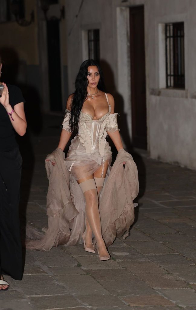 Kim Kardashian in stockings and a corset while out in Venice