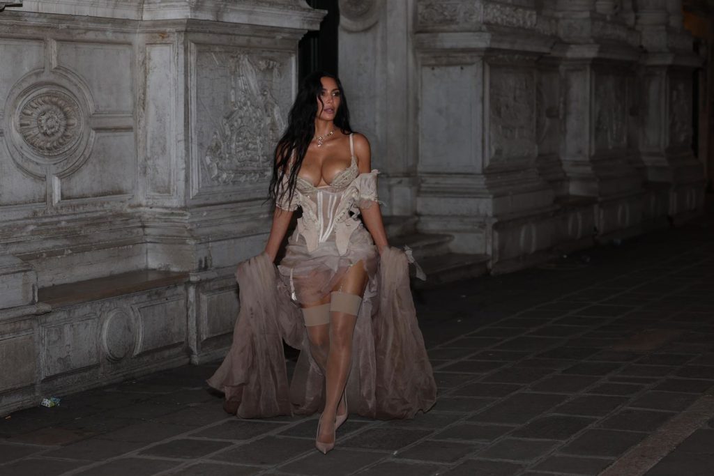Kim Kardashian busty and showing cleavage in lingerie while out in Venice