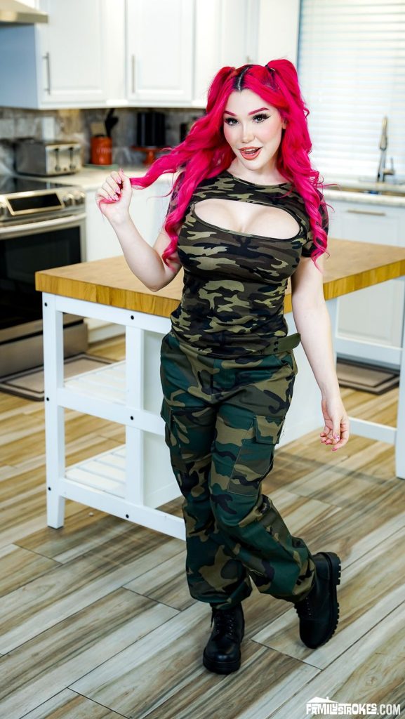 Girl with pink hair wearing camouflage bootcamp clothes