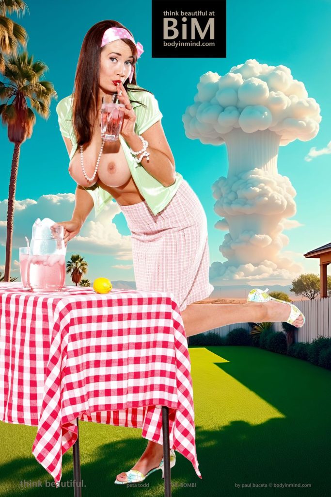 Busty pinup babe is topless while sucking on a straw in front of a big bomb going off in the background