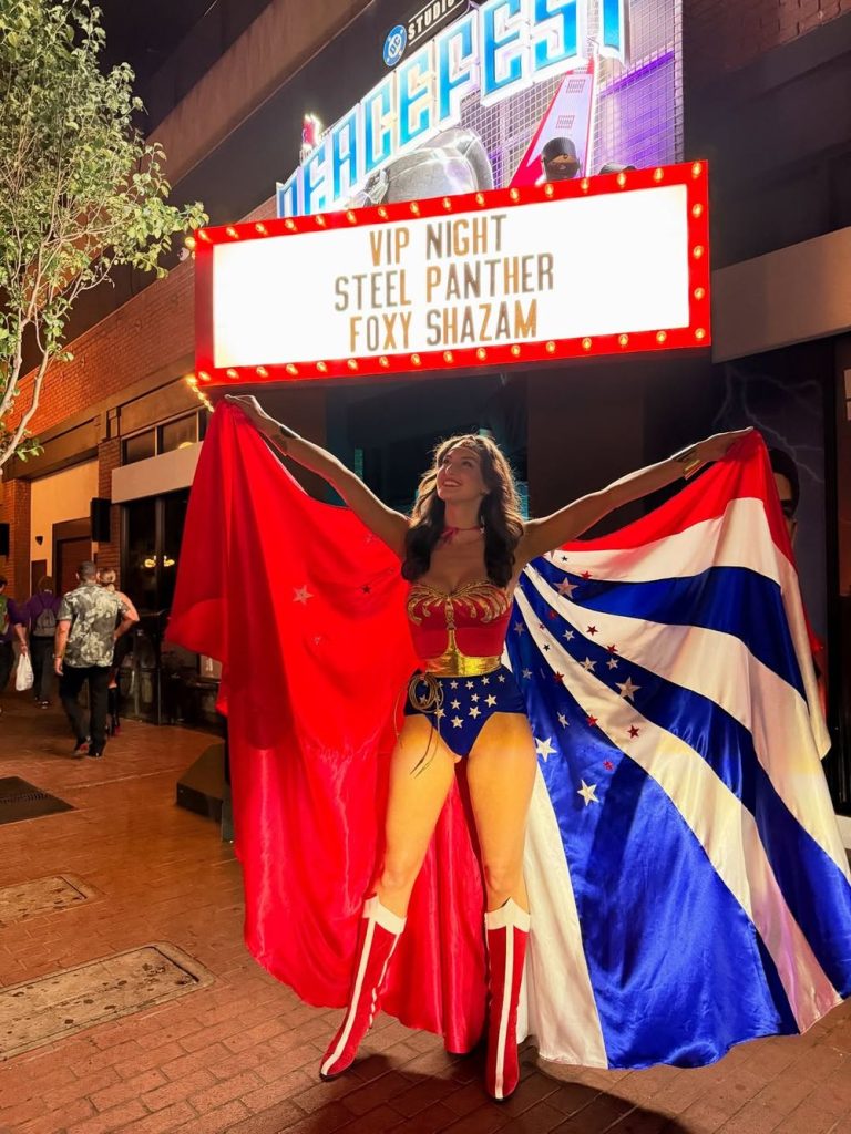 Hot babe cosplay as Wonder Woman outside a movie theatre