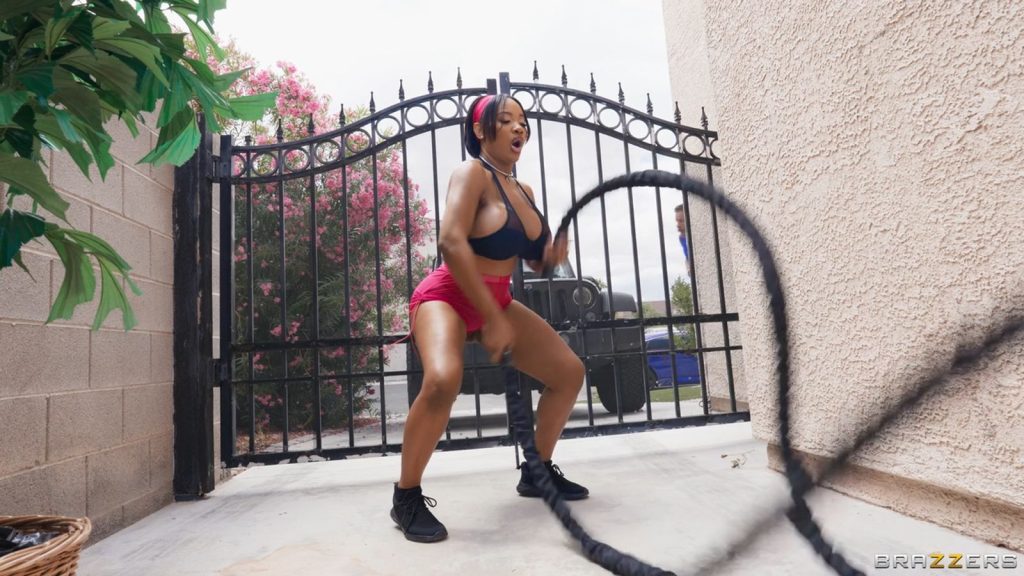 Curvy ebony woman doing a rope workout in her driveway