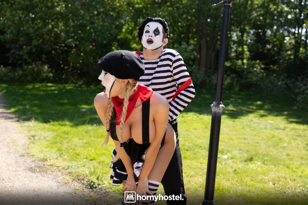 Male and female mime simulates doggystyle sex in the park