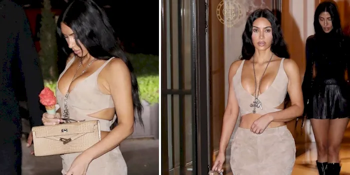 Kim Kardashian boobs in a sexy suede dress