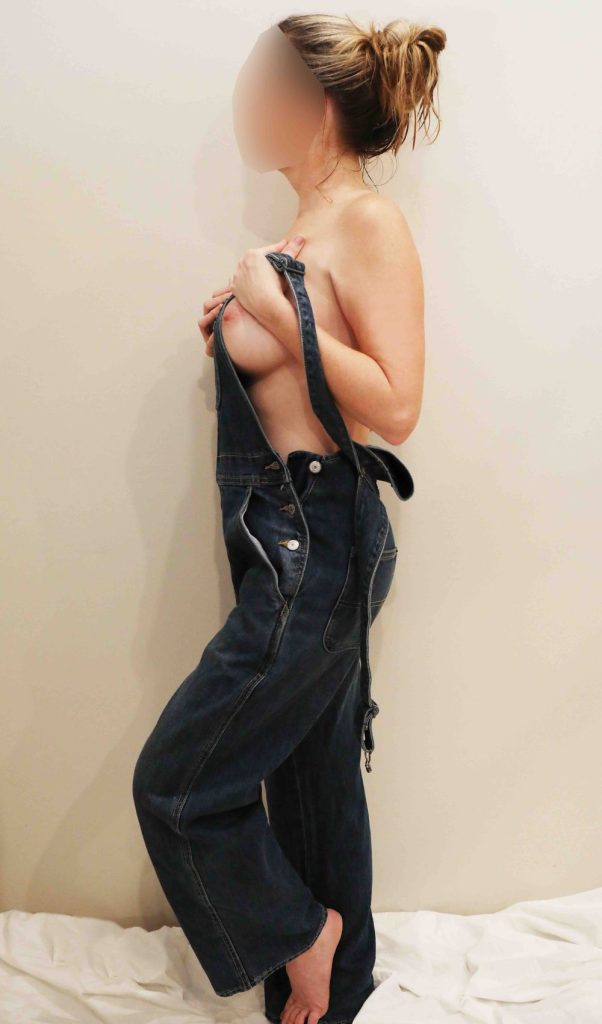 Big tit amateur grabbing her big boobs while topless in overalls