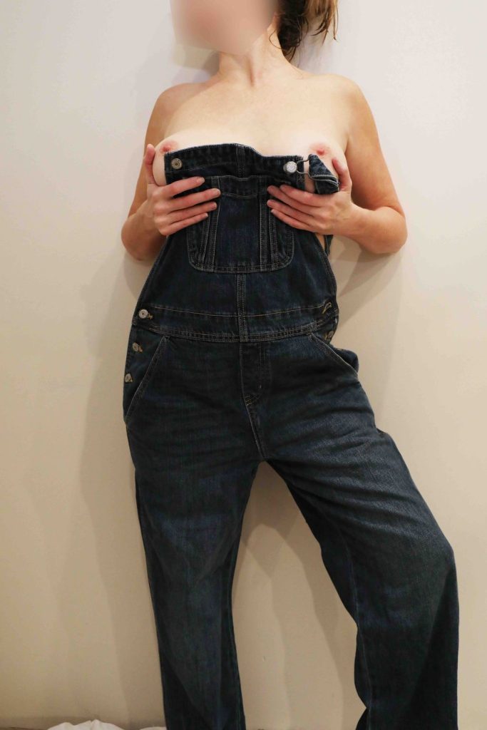 Sexy amateur wife appears to be nude under overalls