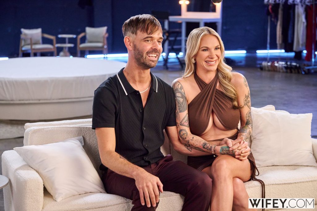 Couple sitting on a couch being interviewed before shooting a porn scene