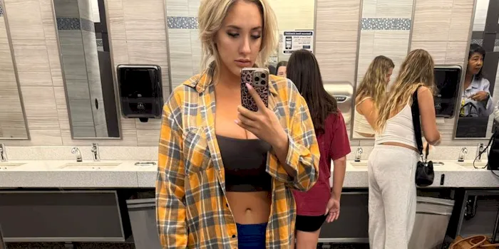 Blonde Sara Blake Cheek selfie at the airport