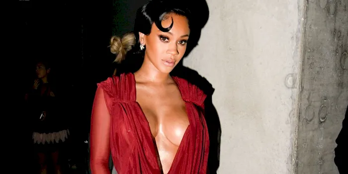 Saweetie showing big boob cleavage in a red dress