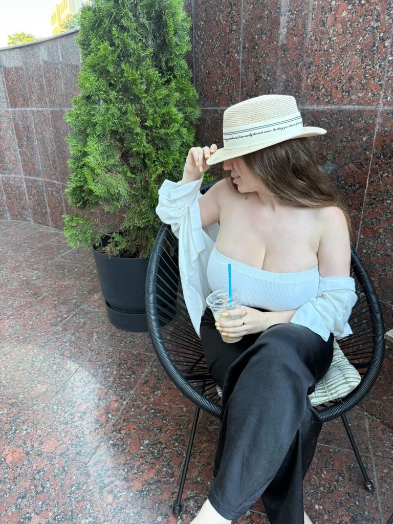 Big boob babe in a low top and hat