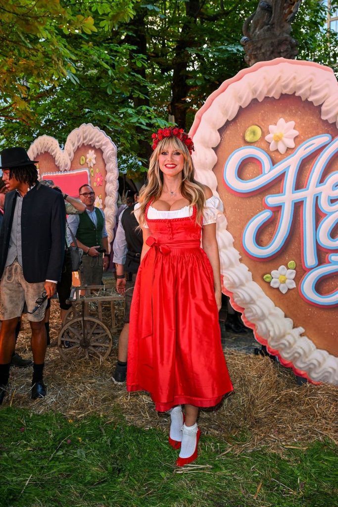 Far away view of Heidi Klum in a traditional German dress