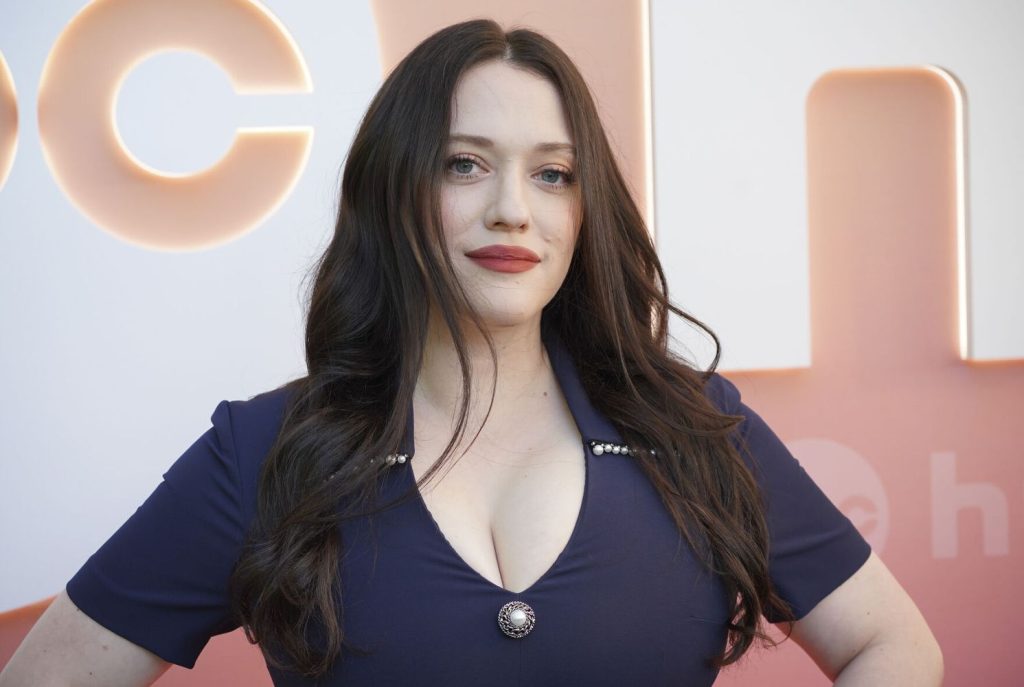 Close up of Kat Dennings showing great cleavage in a blue dress