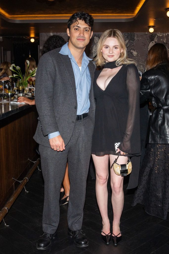 Full body view of Morgan Lily and a man at a party