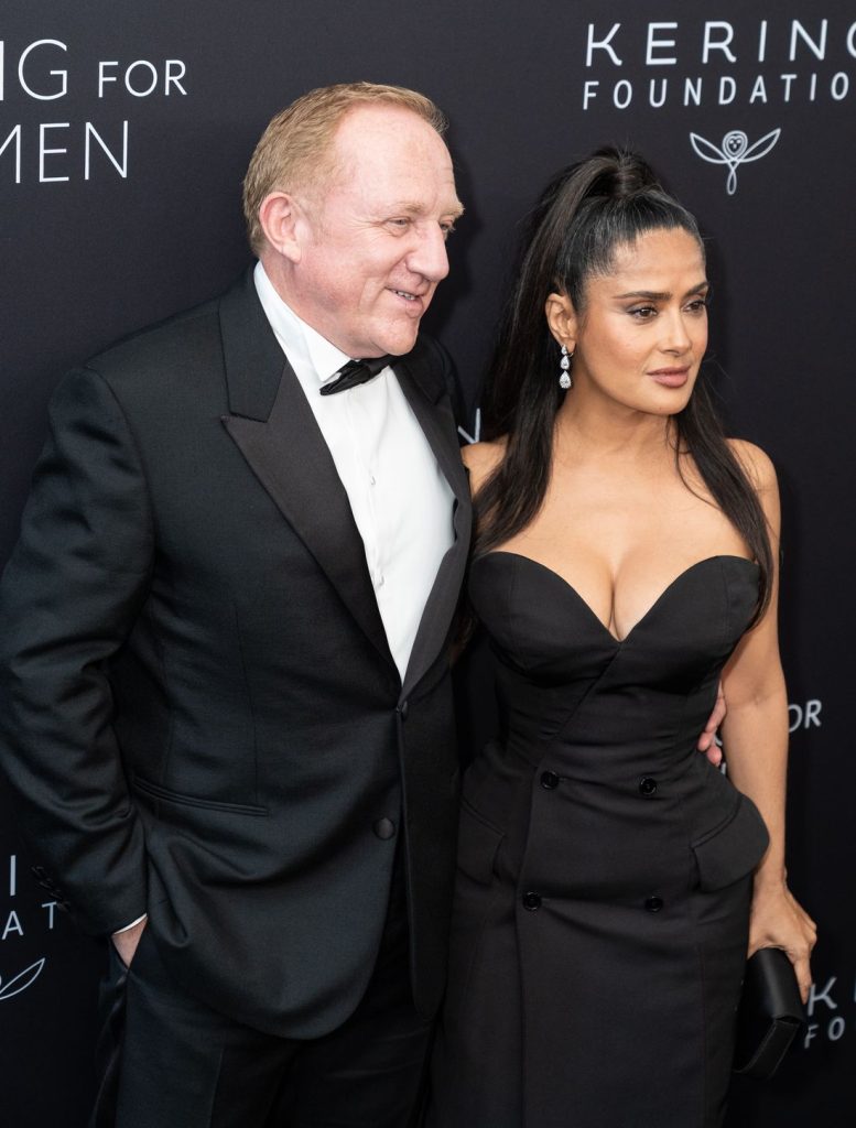 Close up view of Salma Hayek and her husband on the red carpet