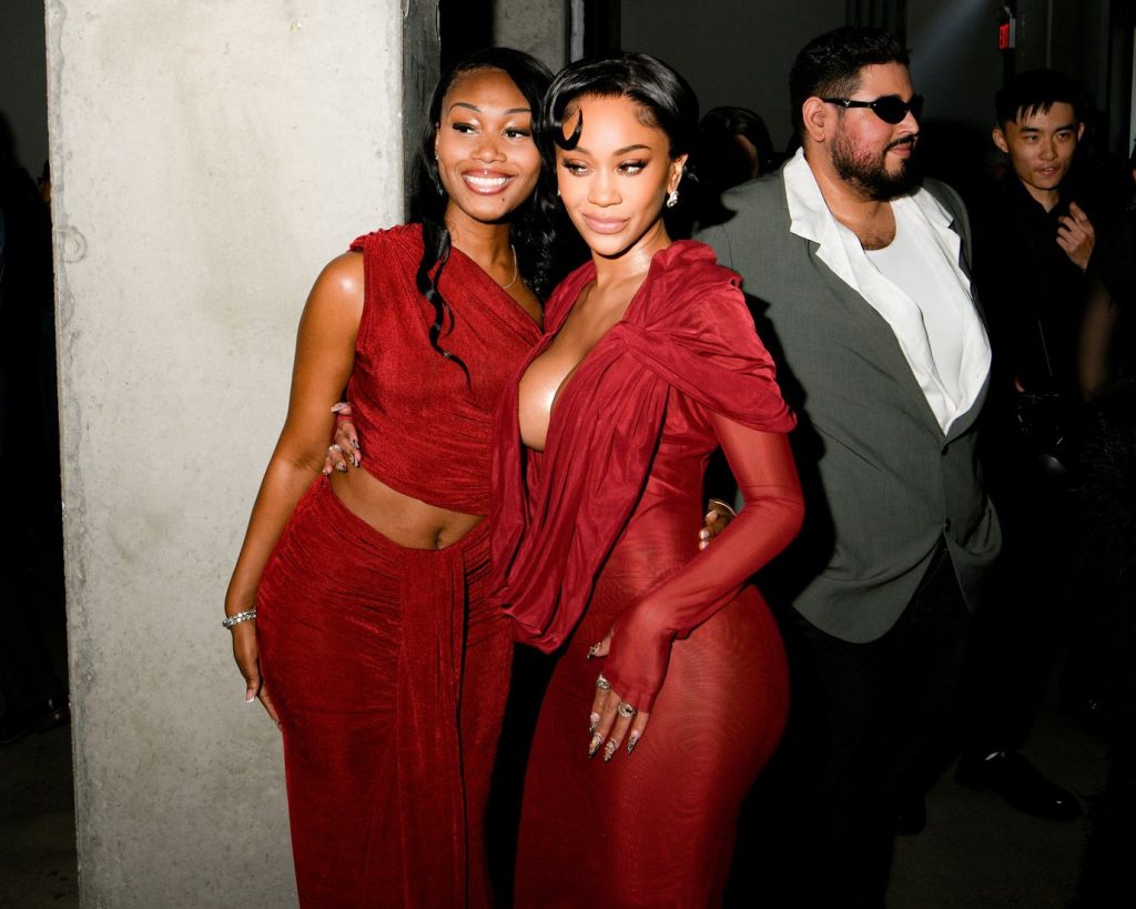 Closer view of the two women in red