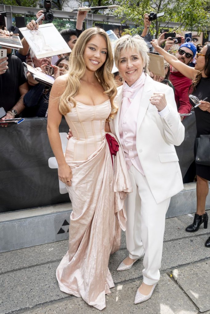 Sydney Sweeney and Christy Martin posing together in front of a crowd in Toronto