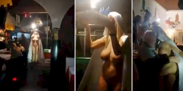 Nude girl with big boobs carrying a birthday cake with sparklers