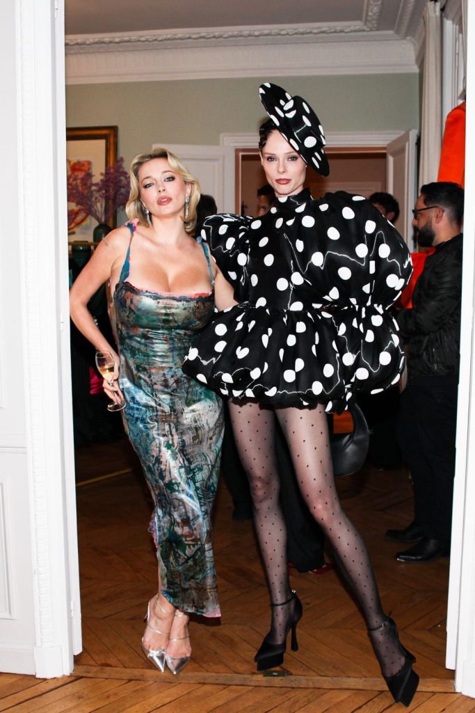 Far away view of Caroline Vreeland and the polka dot woman