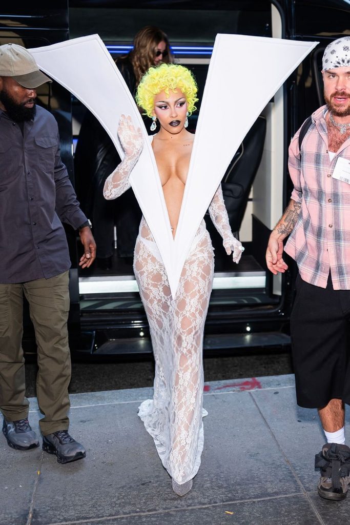 Doja Cat waving hello as she is finally out of the van
