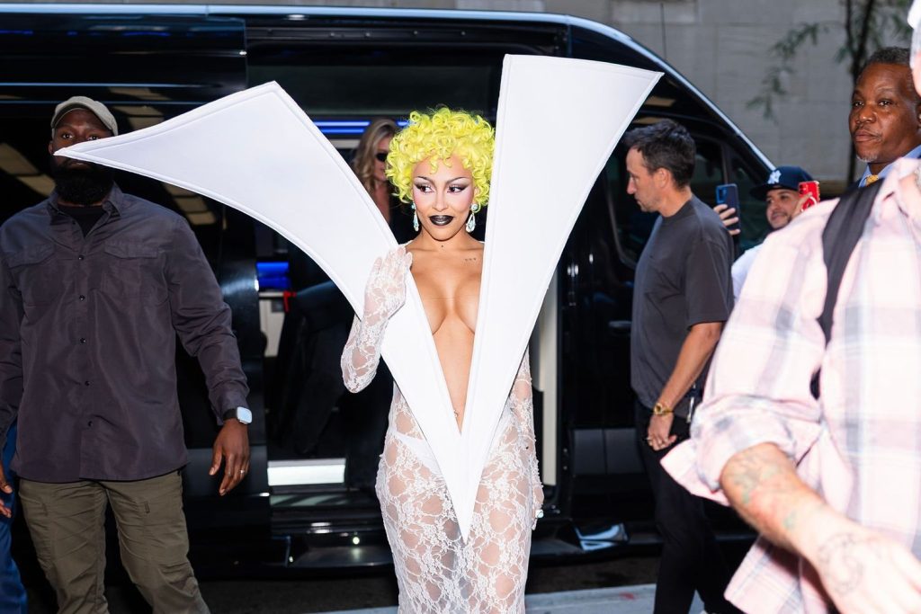 Close up of Doja Cat walking and waving