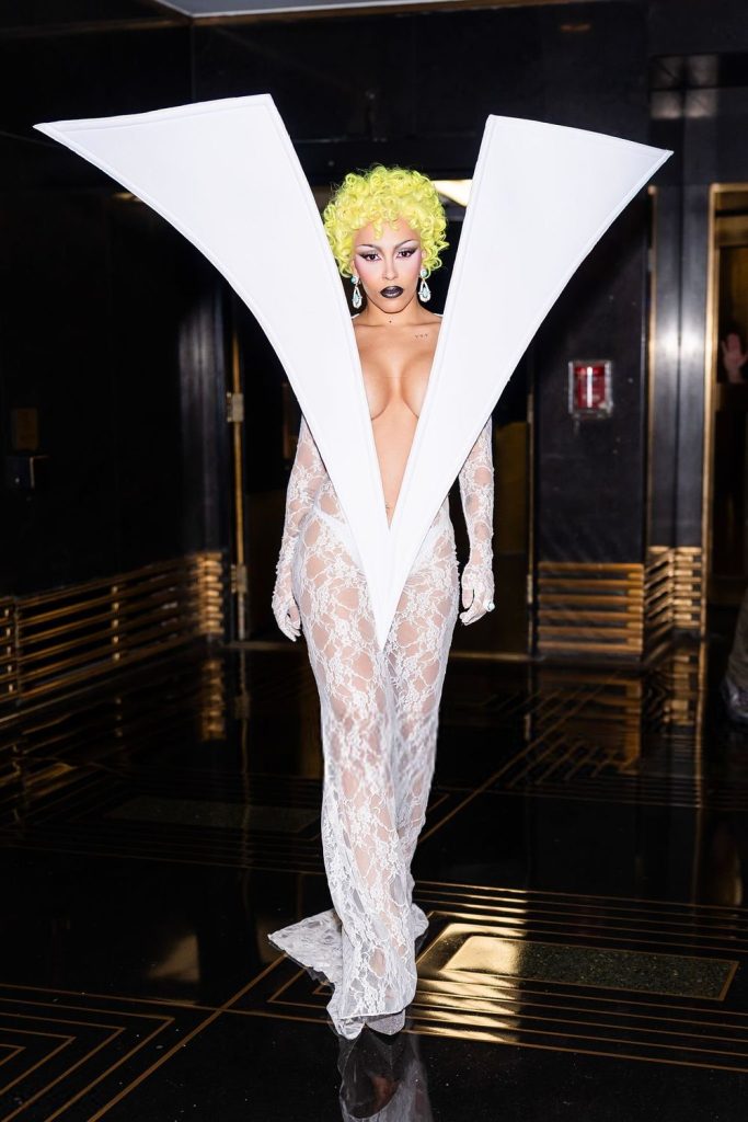 Doja Cat showing cleavage in her big V dress