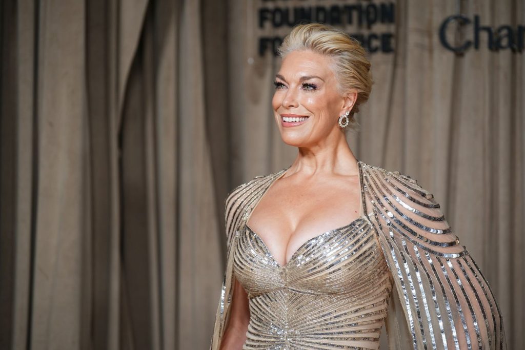 Close up of Hannah Waddingham looking off to the side and her boobs looking big
