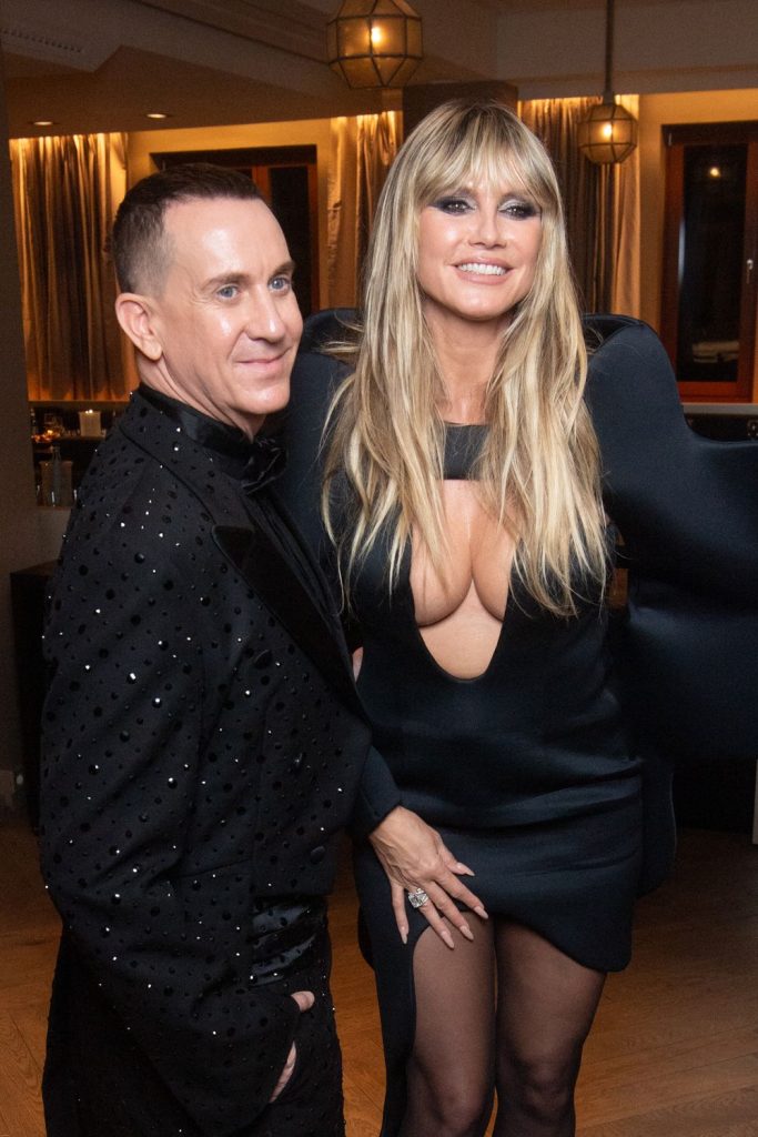Heidi Klum down blouse cleavage while posing with a guy at a red carpet event