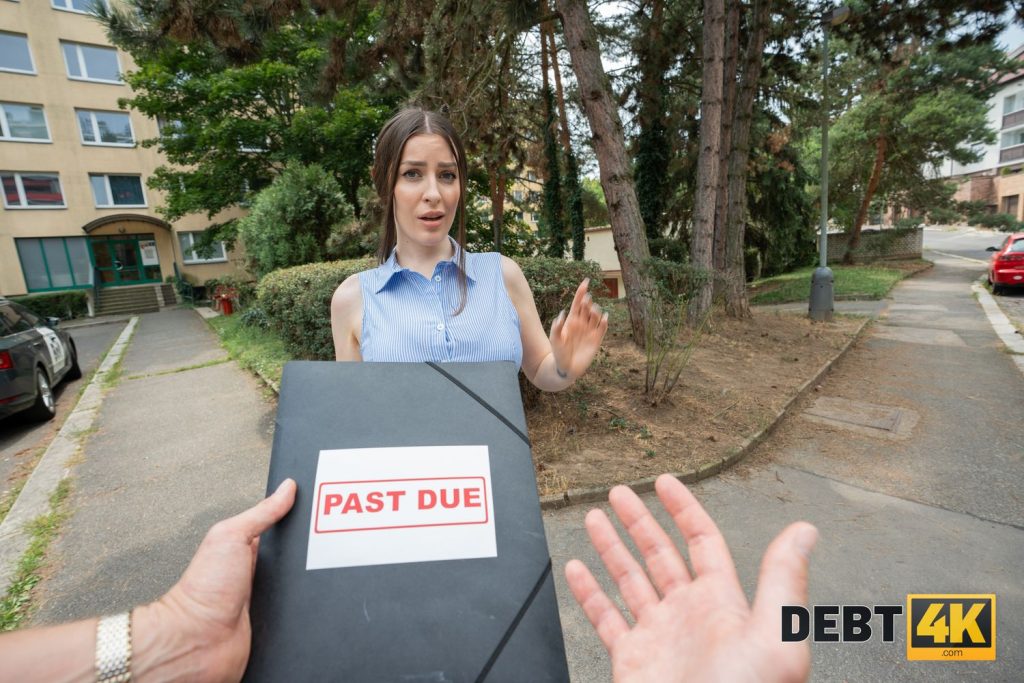 POV of hands holding up a folder that states PAST DUE in front of a woman