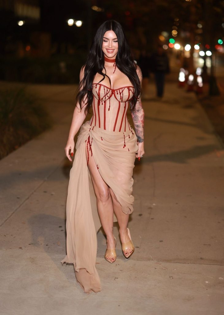 Full body view of Megan Fox in a corset style dress