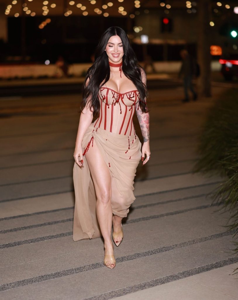 Megan Fox walks and smiles