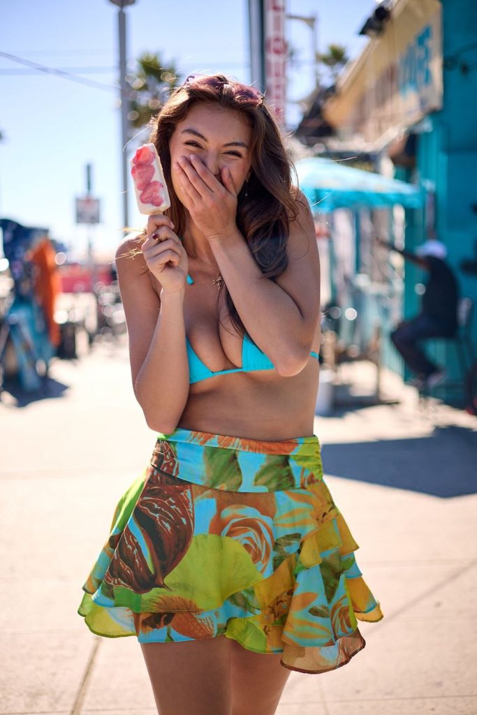 Close up of Rachel Pizzolato laughing and holding a hand up to her face