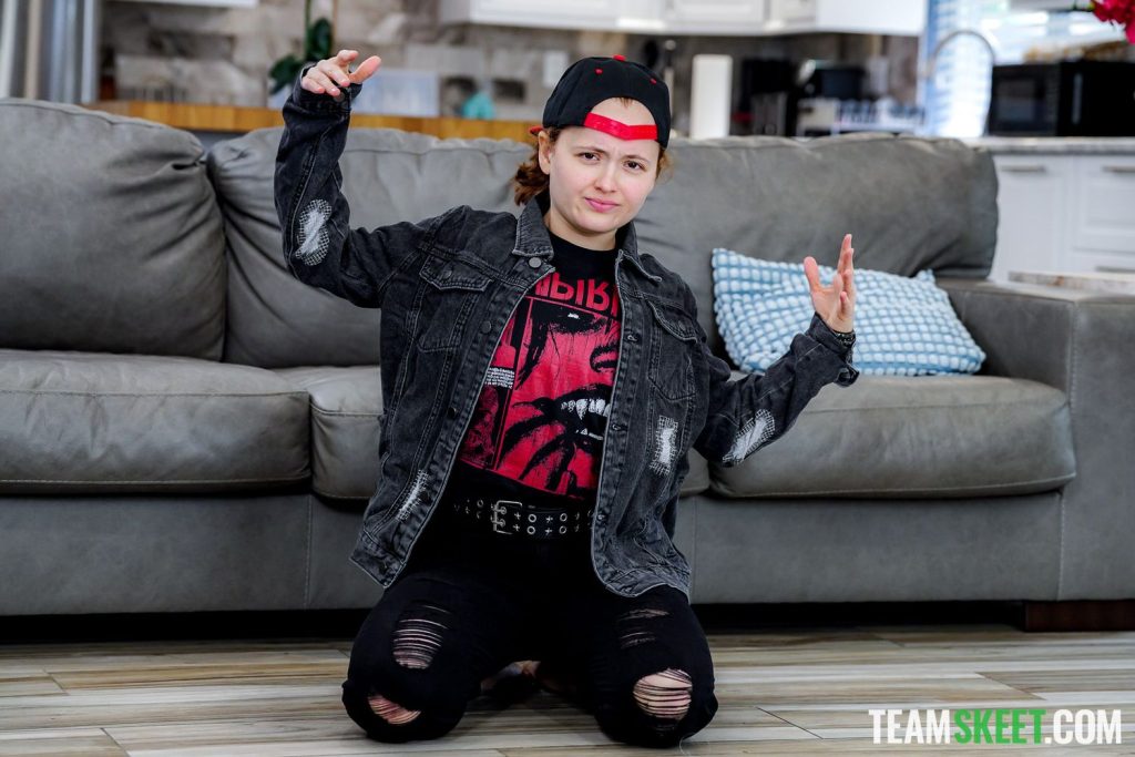 Tom boy on her knees and throwing up hands