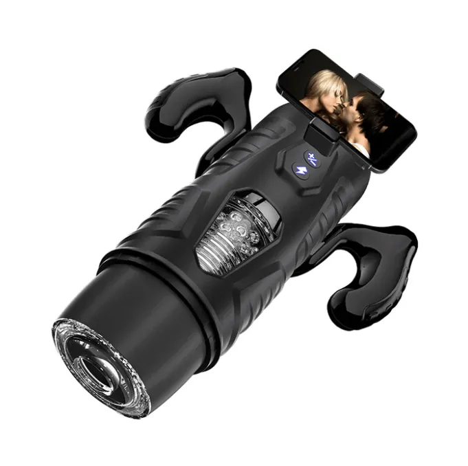 Male stroker sex toy with a phone attached to it
