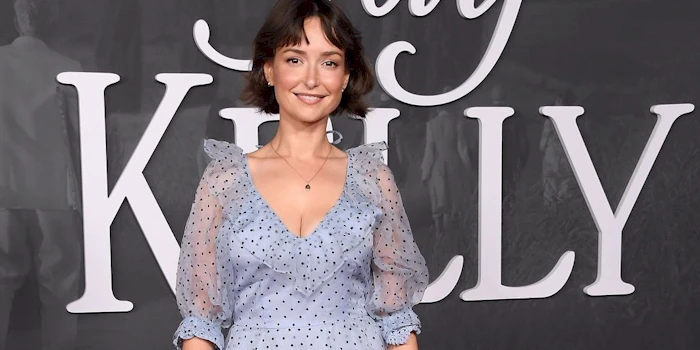 Close up of a smiling woman wearing a pretty dress