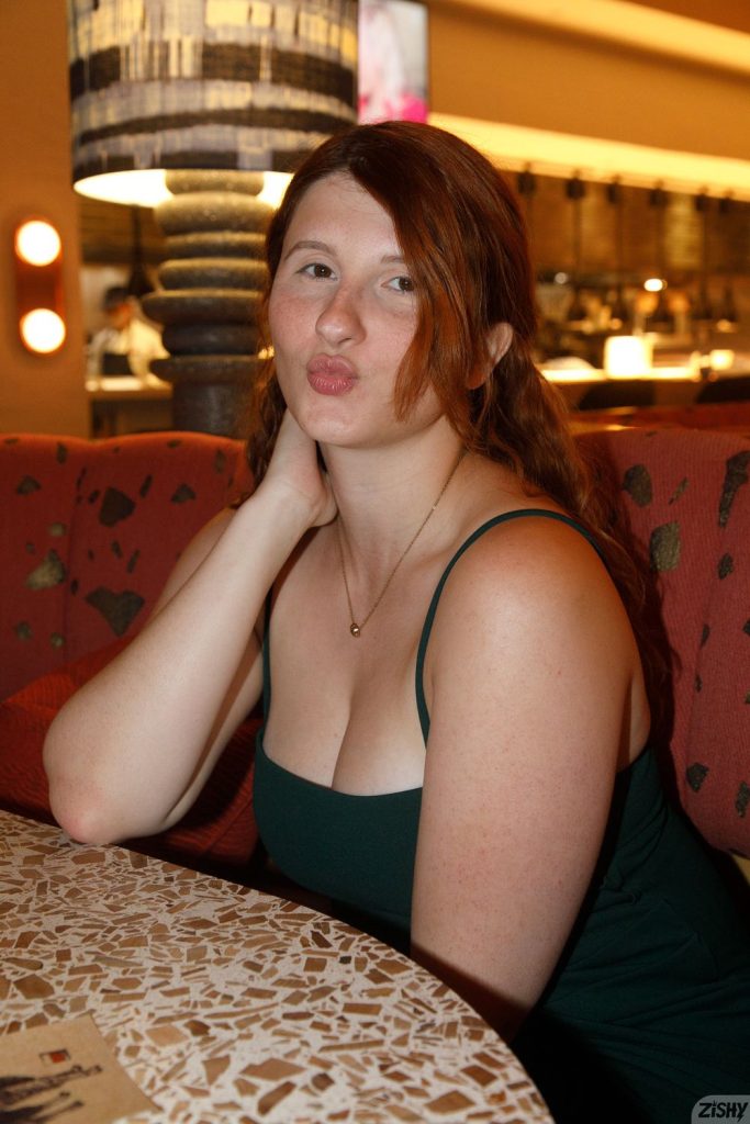 Close up of woman now without glasses making a kiss face