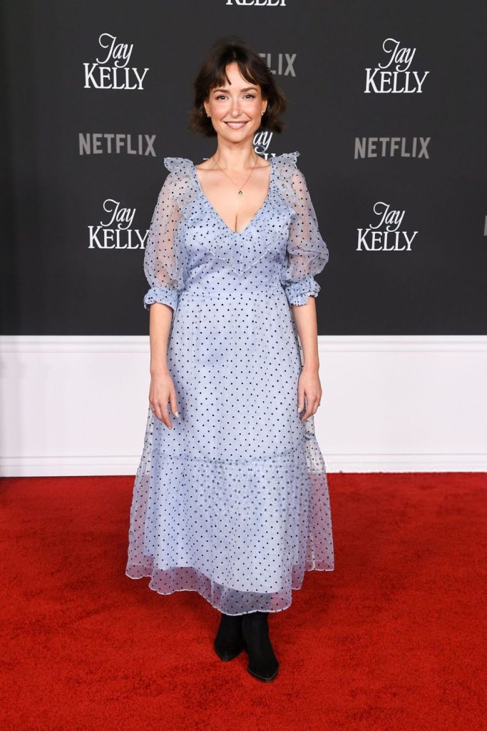 Frontal full body view of Milana Vayntrub posing on the red carpet