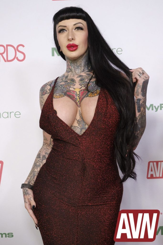 Close up of porn star with big breasts and a lot tattoos on the red carpet