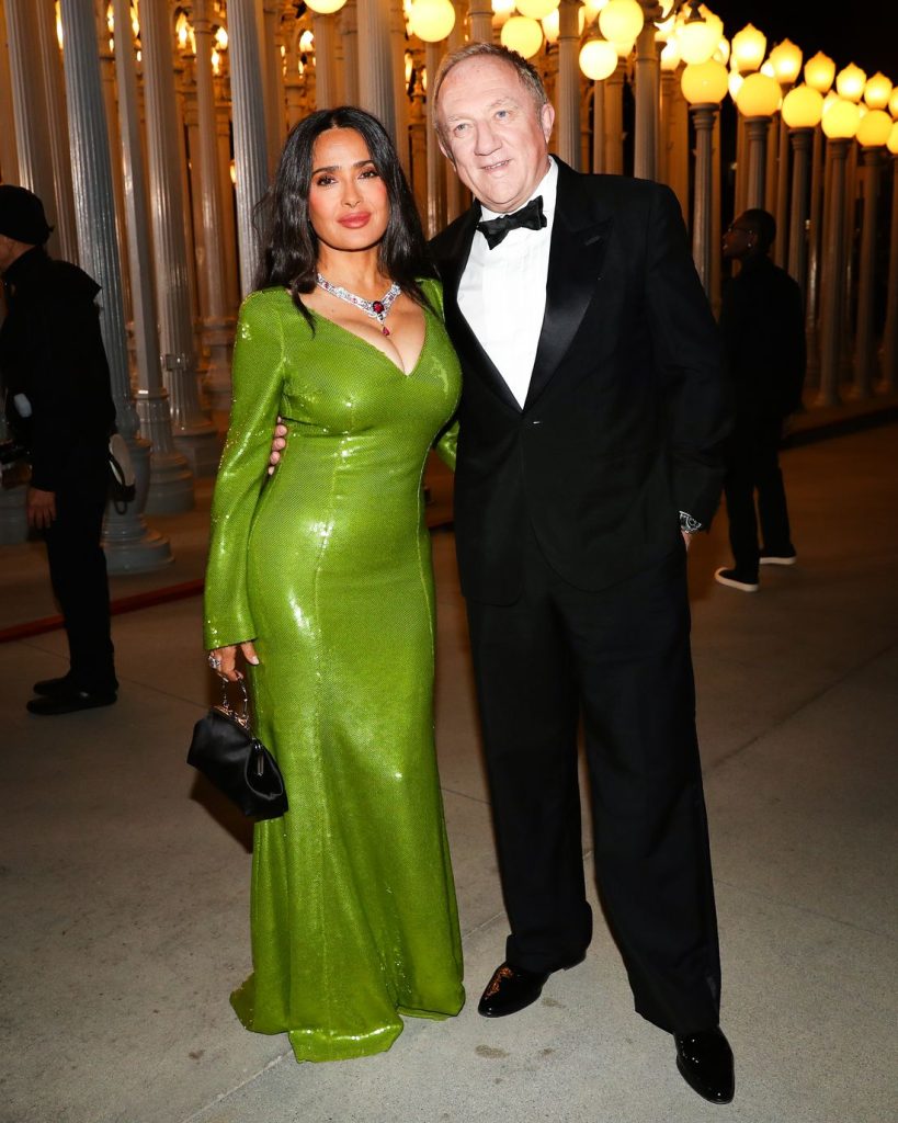 Full body view of Salma Hayek and her husband