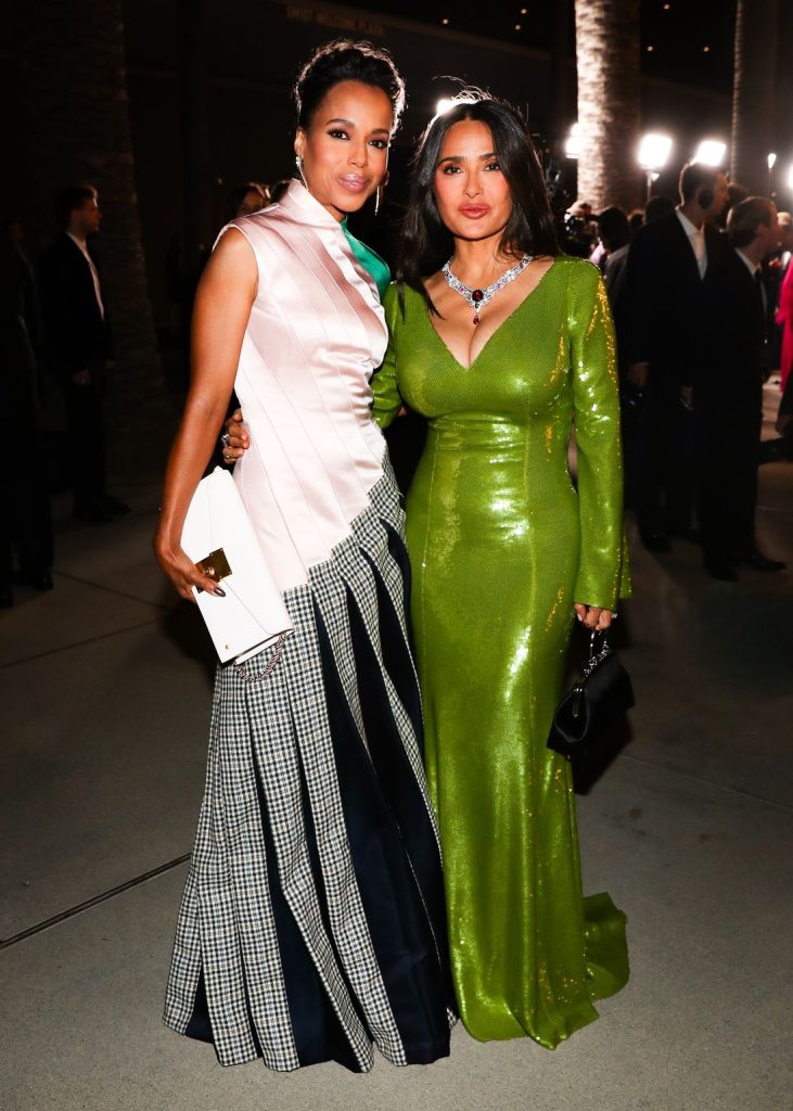 Full body view of Salma Hayek posing next to another woman