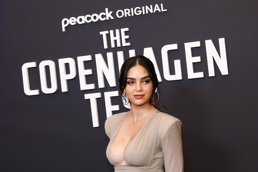 Close up side view of Melissa Barrera on a red carpet