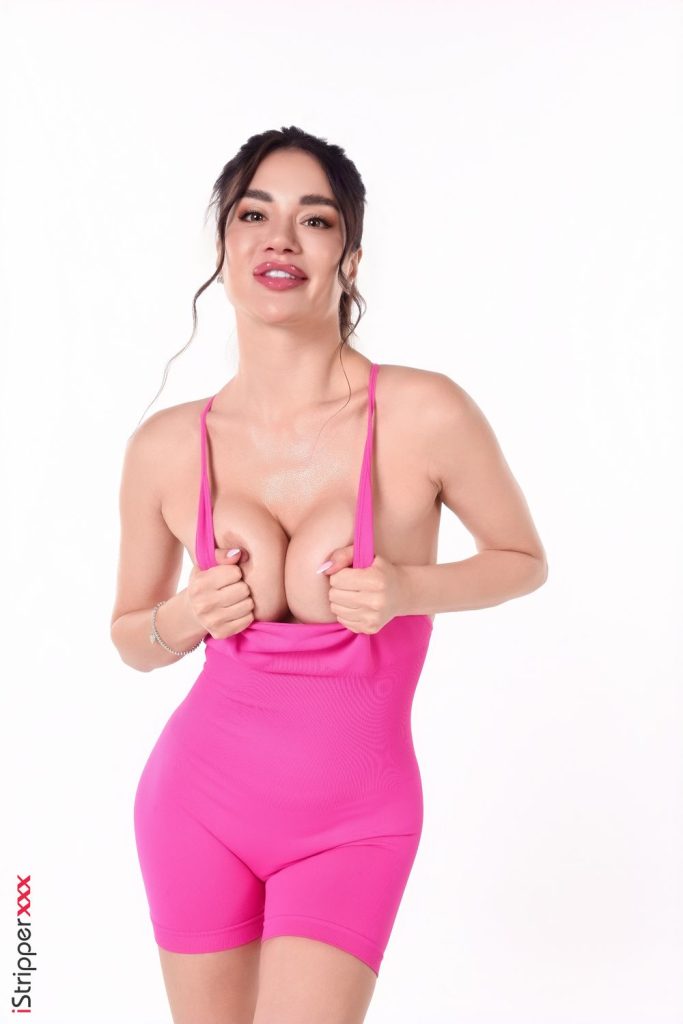 Frontal of woman pushing her breasts together and leaning forward