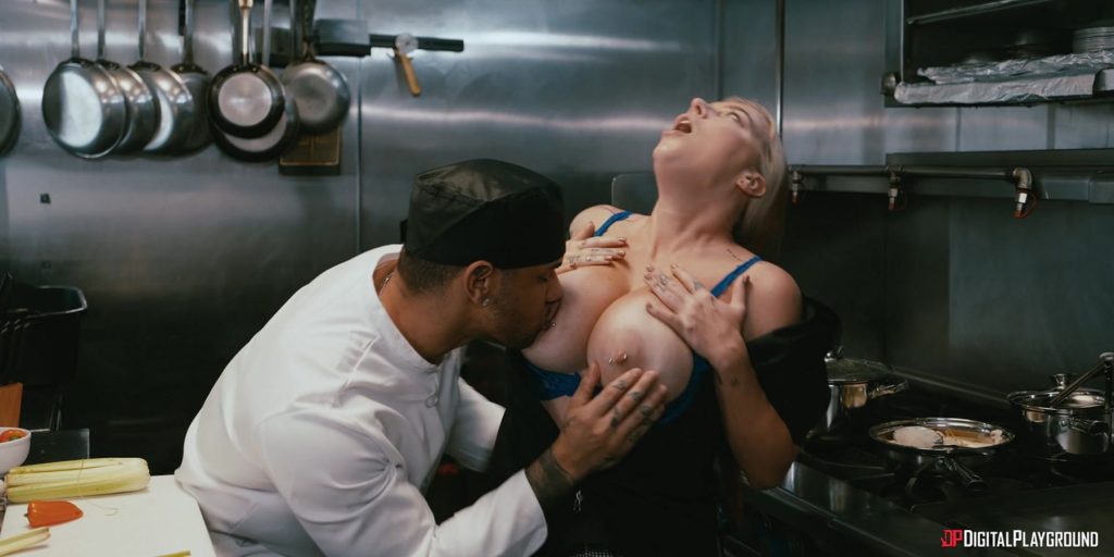 Male sous chef kissing and finding female chef's big breasts